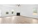 Bright living room with new floors, a ceiling fan, a fireplace, and lots of natural light at 2528 Morgan Chase Dr, Buford, GA 30519