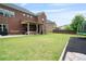 Well-maintained backyard with a covered patio perfect for outdoor entertaining and trampoline at 3352 Stone Point Way, Buford, GA 30519