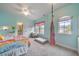 Bright bedroom featuring a ceiling fan, carpet floors, and two windows with pink valances, creating a cheerful and inviting space at 3352 Stone Point Way, Buford, GA 30519