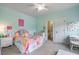 Bright bedroom featuring a ceiling fan, carpet floors, and a connecting bathroom at 3352 Stone Point Way, Buford, GA 30519
