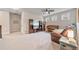 Spacious carpeted living room with neutral tones, built-in shelving, and a cozy atmosphere at 3352 Stone Point Way, Buford, GA 30519