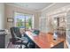 Bright office space featuring French doors, hardwood floors, and a large window providing natural light at 3352 Stone Point Way, Buford, GA 30519