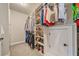 Well-organized walk-in closet features ample shelving and hanging space for clothing and shoes at 3352 Stone Point Way, Buford, GA 30519