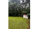A spacious backyard with a weathered storage shed and lush greenery at 5568 Bradley Cir, Lithonia, GA 30038