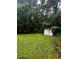 A spacious backyard with a weathered storage shed and lush greenery at 5568 Bradley Cir, Lithonia, GA 30038