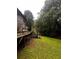 View of backyard, deck, and staircase needing repair at 5568 Bradley Cir, Lithonia, GA 30038