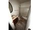 Bathroom featuring a toilet, shower, and sink in need of repairs at 5568 Bradley Cir, Lithonia, GA 30038