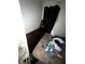 Interior view of bedroom highlighting a bed and cluttered personal items at 5568 Bradley Cir, Lithonia, GA 30038