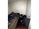 Interior view of bedroom highlighting a bed and cluttered personal items at 5568 Bradley Cir, Lithonia, GA 30038