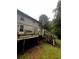 Elevated back deck and weathered staircase on a two-story home at 5568 Bradley Cir, Lithonia, GA 30038