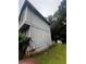 Side of a two-story home with gray siding and a view of the yard at 5568 Bradley Cir, Lithonia, GA 30038