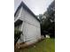 Exterior side view of this home needing TLC at 5568 Bradley Cir, Lithonia, GA 30038