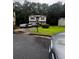 Charming two-story home featuring gray siding, red shutters, and a well-maintained front lawn at 5568 Bradley Cir, Lithonia, GA 30038