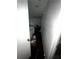 Hallway of home showing damaged floors and walls at 5568 Bradley Cir, Lithonia, GA 30038