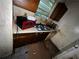 Kitchen with window needing repair and dirty countertop at 5568 Bradley Cir, Lithonia, GA 30038
