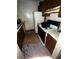 Deteriorated kitchen featuring damaged floors and dated appliances, emphasizing need for significant refurbishment at 5568 Bradley Cir, Lithonia, GA 30038
