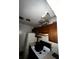 Dilapidated kitchen featuring outdated appliances and water damaged ceiling, creating an undesirable living space at 5568 Bradley Cir, Lithonia, GA 30038