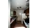 Poorly maintained kitchen showcasing outdated cabinets and appliances, indicative of neglect needing comprehensive renovation at 5568 Bradley Cir, Lithonia, GA 30038