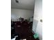 Untidy living room area displaying peeling paint and scattered items, emphasizing need for remodeling and decluttering at 5568 Bradley Cir, Lithonia, GA 30038
