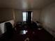 Room in need of repair with dirty carpet and peeling paint at 5568 Bradley Cir, Lithonia, GA 30038