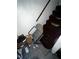 Dilapidated stairwell featuring trash and deteriorated carpet requiring significant repairs for a safe and appealing entryway at 5568 Bradley Cir, Lithonia, GA 30038