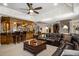 Entertaining basement featuring a seating area and wet bar perfect for hosting gatherings at 8295 St Marlo Fairway Dr, Duluth, GA 30097