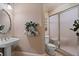 Bathroom featuring a pedestal sink and glass shower enclosure for spa like retreat at 8295 St Marlo Fairway Dr, Duluth, GA 30097