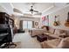 Spacious bedroom featuring a tray ceiling, a seating area and an attached workspace at 8295 St Marlo Fairway Dr, Duluth, GA 30097