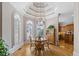Sunlit breakfast nook with a chandelier, large windows, and custom trim work at 8295 St Marlo Fairway Dr, Duluth, GA 30097