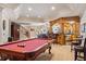 Spacious recreation room features a pool table with a built in bar at 8295 St Marlo Fairway Dr, Duluth, GA 30097