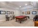 Recreation room has a pool table with furniture for entertaining at 8295 St Marlo Fairway Dr, Duluth, GA 30097
