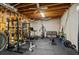Basement gym equipped with a weight rack and fitness equipment for exercise at 8295 St Marlo Fairway Dr, Duluth, GA 30097