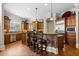 Spacious kitchen featuring a large island with seating, stainless steel appliances, and custom cabinetry at 8295 St Marlo Fairway Dr, Duluth, GA 30097
