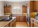 Modern kitchen featuring stainless steel appliances, custom cabinetry, and granite countertops at 8295 St Marlo Fairway Dr, Duluth, GA 30097