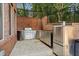 This outdoor kitchen features stainless steel appliances, a built-in grill, and ample counter space, perfect for outdoor entertaining at 8295 St Marlo Fairway Dr, Duluth, GA 30097