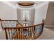 Staircase with custom iron railings and a chandelier at 8295 St Marlo Fairway Dr, Duluth, GA 30097