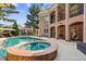This backyard oasis boasts a sparkling pool, relaxing hot tub, and a spacious patio, great for enjoying outdoor living at 8295 St Marlo Fairway Dr, Duluth, GA 30097