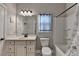 Well-lit bathroom with a vanity, toilet, and shower featuring modern fixtures and finishes at 3112 Patriot Sw Sq, Marietta, GA 30064