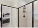 Sleek bathroom shower with glass enclosure, and view of a bedroom at 3112 Patriot Sw Sq, Marietta, GA 30064