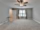 Spacious bedroom with neutral walls, carpet, ceiling fan, and window with curtains at 3112 Patriot Sw Sq, Marietta, GA 30064