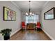 Dining room with hardwood floors, chandelier, and natural light at 3112 Patriot Sw Sq, Marietta, GA 30064