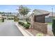 Neighborhood entrance featuring stone signage and manicured landscaping at 3112 Patriot Sw Sq, Marietta, GA 30064