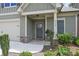 Inviting front porch with stone accents and well-maintained landscaping at 3112 Patriot Sw Sq, Marietta, GA 30064