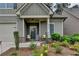 Cozy front porch features stone accents, a welcoming entrance and charming seating area at 3112 Patriot Sw Sq, Marietta, GA 30064