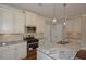 Modern kitchen with granite countertops, stainless steel appliances, and ample cabinet space at 3112 Patriot Sw Sq, Marietta, GA 30064