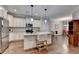 Well-lit kitchen featuring white cabinetry, a center island, and stainless steel appliances at 3112 Patriot Sw Sq, Marietta, GA 30064