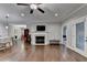 Spacious living area featuring hardwood floors, a cozy fireplace, and an open floor plan at 3112 Patriot Sw Sq, Marietta, GA 30064