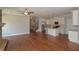 Open concept living space with kitchen, hardwood floors, stainless appliances, and natural light at 3112 Patriot Sw Sq, Marietta, GA 30064