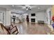 Spacious living area featuring hardwood floors, a cozy fireplace, and an open floor plan at 3112 Patriot Sw Sq, Marietta, GA 30064