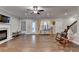 Comfortable living room showcasing a fireplace, hardwood floors, and access to the backyard at 3112 Patriot Sw Sq, Marietta, GA 30064